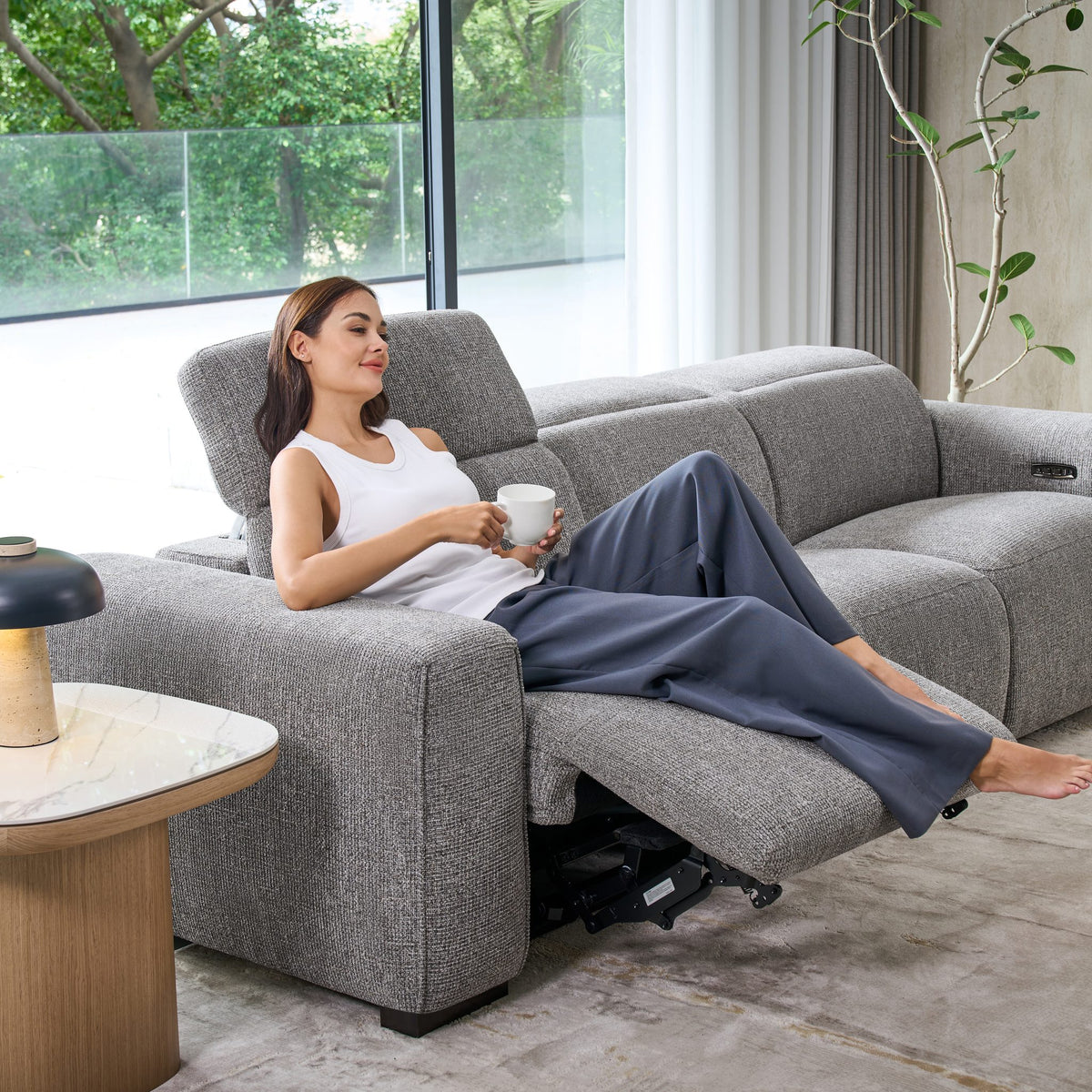 Close-up of a reclined Jeddah seat with the powered headrest raised