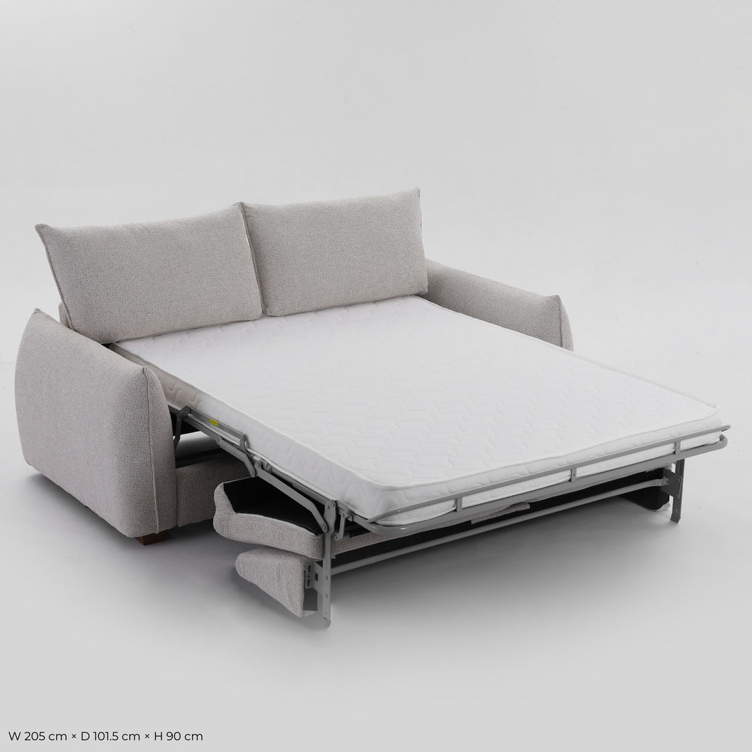 Franka Sofa Bed folded out into a double bed, angled studio view showing the mattress and steel frame