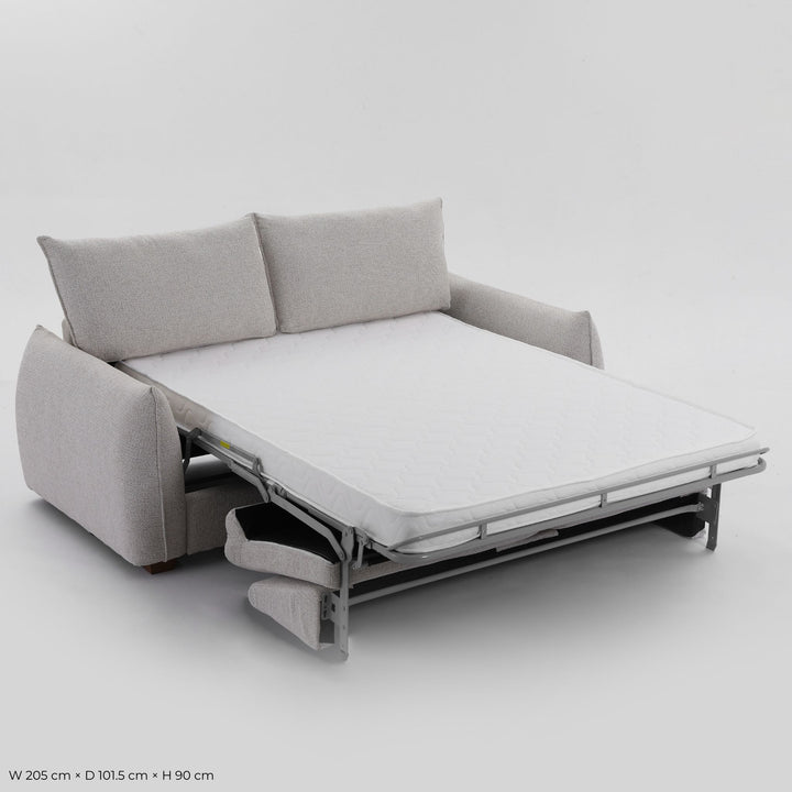 Franka Sofa Bed folded out into a double bed, angled studio view showing the mattress and steel frame