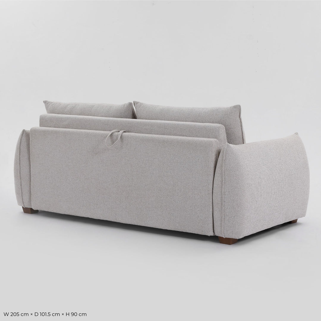Rear three-quarter view of the Franka Sofa Bed with the fold-out release strap on the back