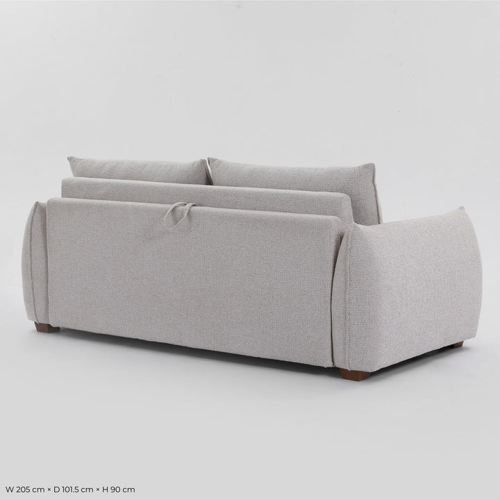 Rear three-quarter view of the Franka Sofa Bed with the fold-out release strap on the back