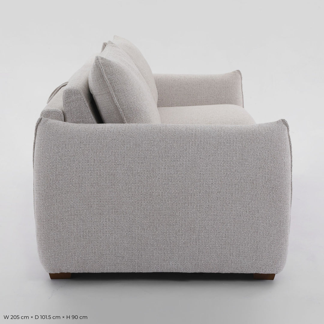 Franka Sofa Bed side profile showing the arm and seat depth on a studio background