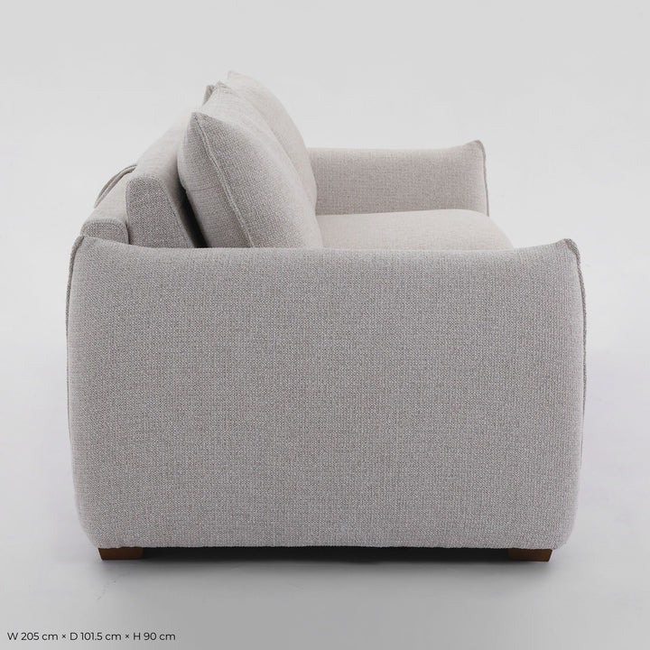 Franka Sofa Bed side profile showing the arm and seat depth on a studio background