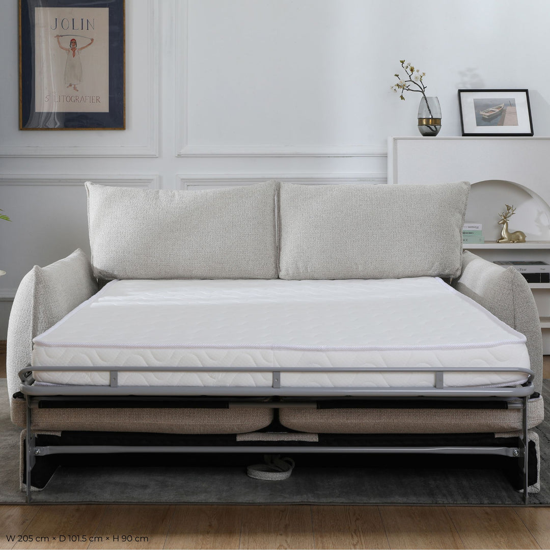 Franka Sofa Bed converted into a double bed, front view with the mattress extended in a living room