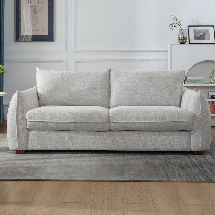 Franka Sofa Bed three-seat sofa in light grey woven fabric, front view in a living room setting