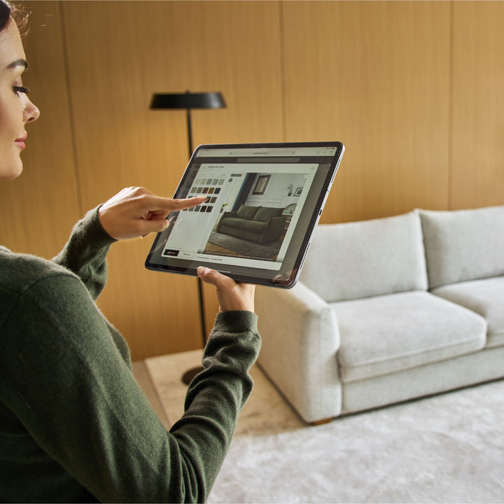 Customer browsing Nadia Sofa Bed cover options on a tablet
