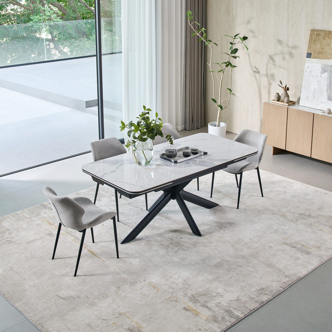 Ames Extension Dining Table closed, with four grey dining chairs
