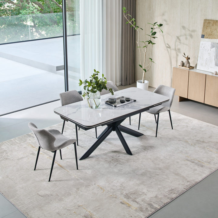 Ames Extension Dining Table closed, with four grey dining chairs