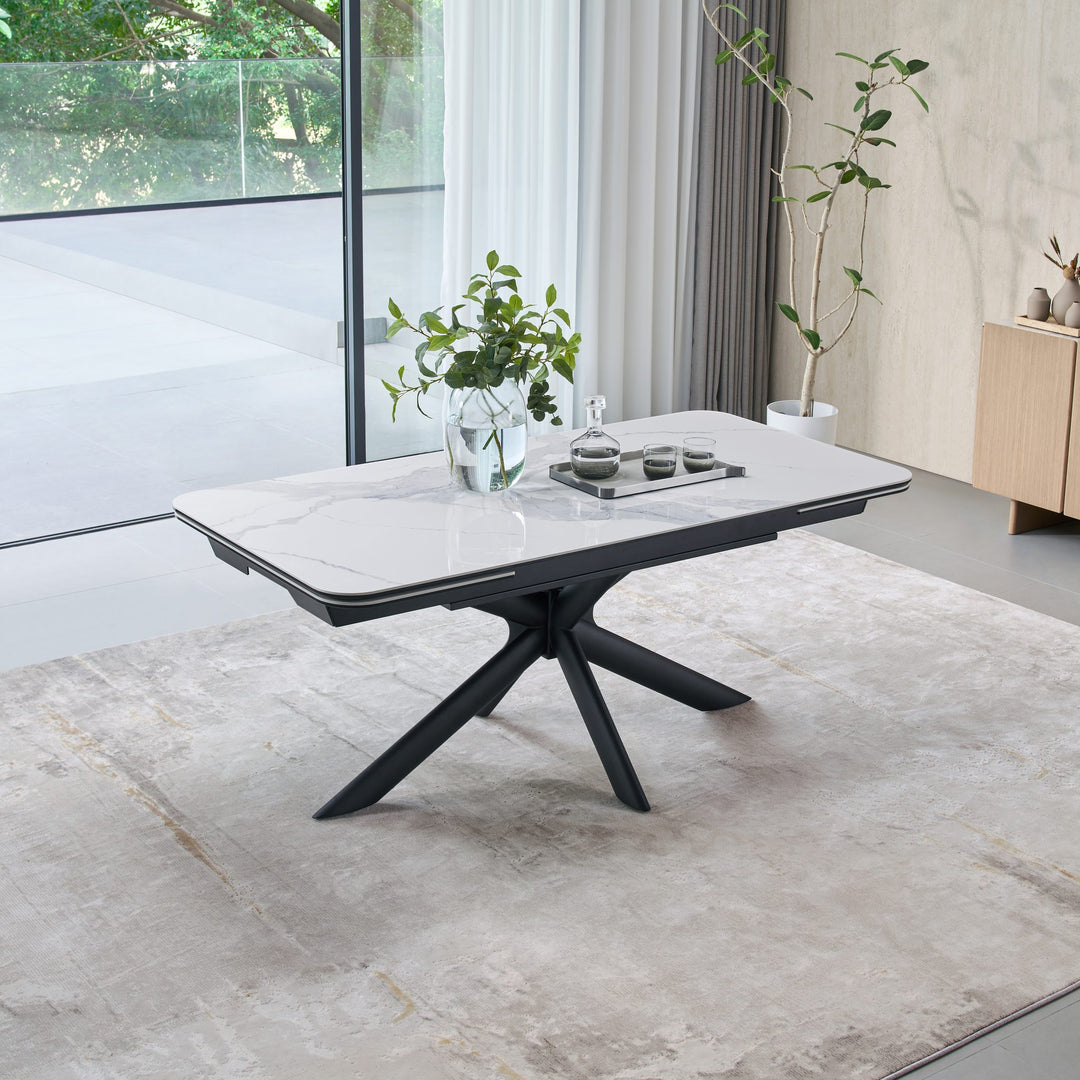Ames Extension Dining Table with a Bianco ceramic top on a black star base, closed at 180cm