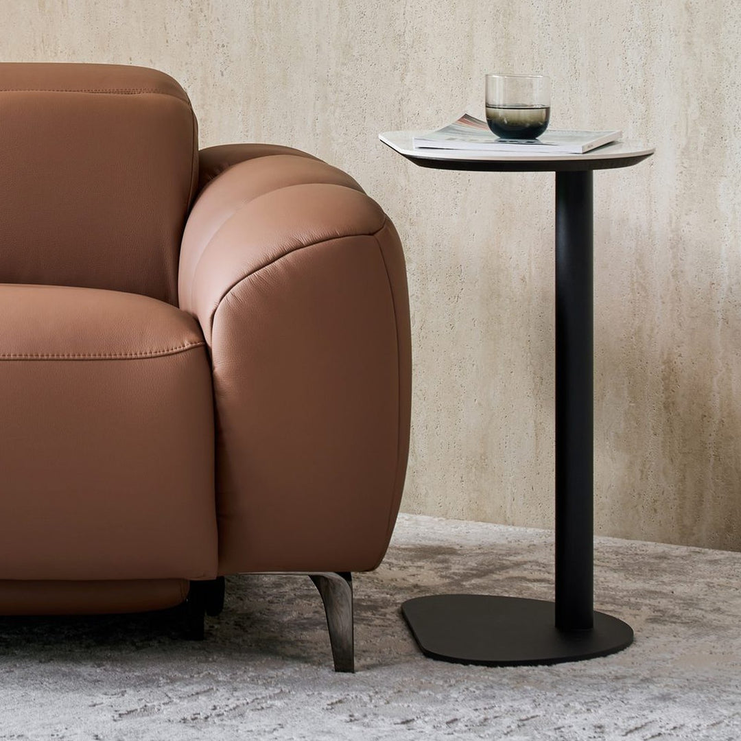 Ava Side Table beside a tan leather recliner armchair