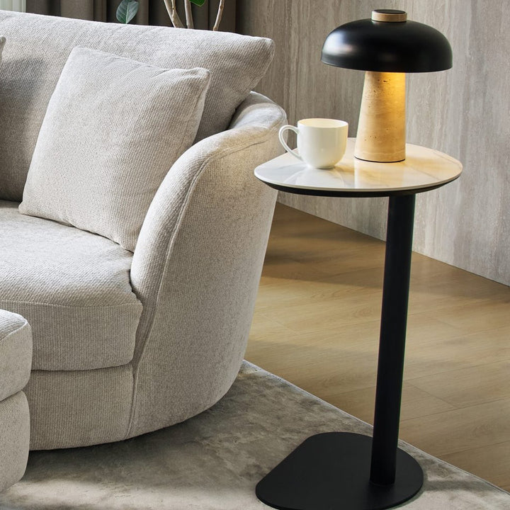 Ava Side Table holding a table lamp and coffee cup beside an accent chair