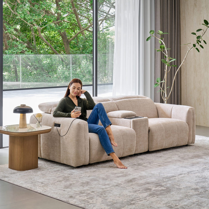Woman on the Bailey 2 Seat Sofa with a Sofa Media Console, charging her phone