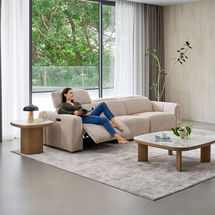 Woman relaxing on the Bailey 3 Seat Sofa with the end seat reclined