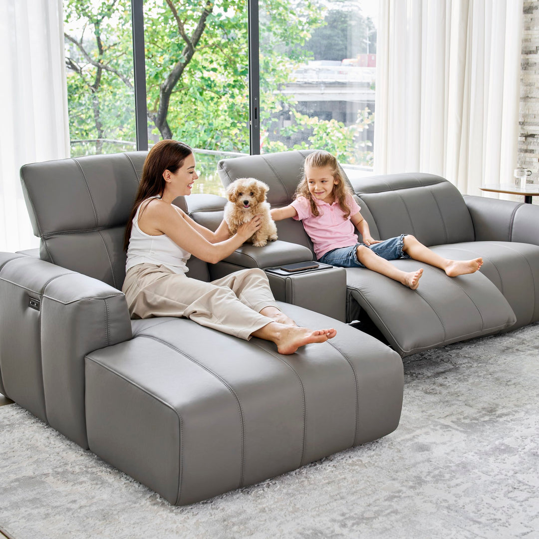 Mother and daughter relaxing on the Bailey Chaise Sofa in grey leather