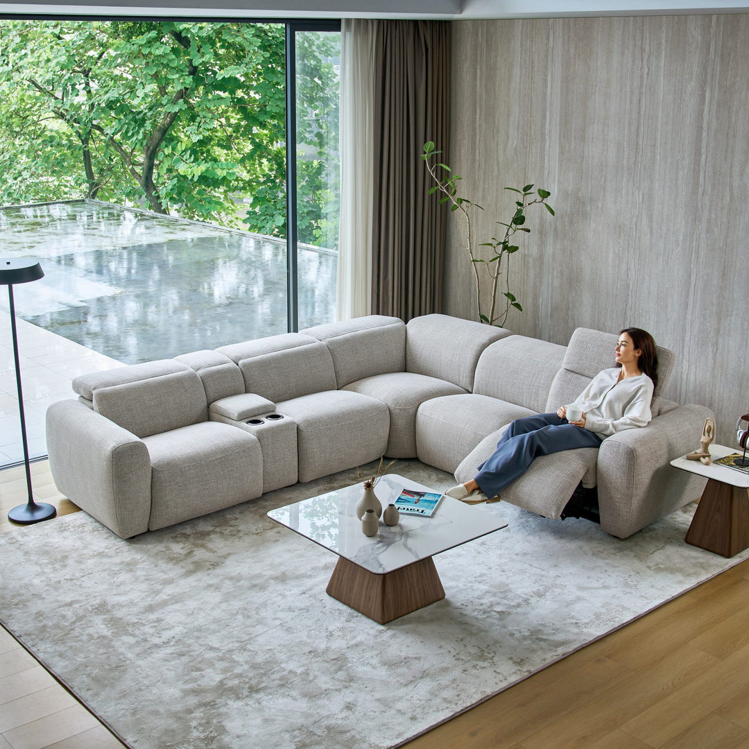 Cambridge corner sofa in light grey fabric with a seat reclined and a media console