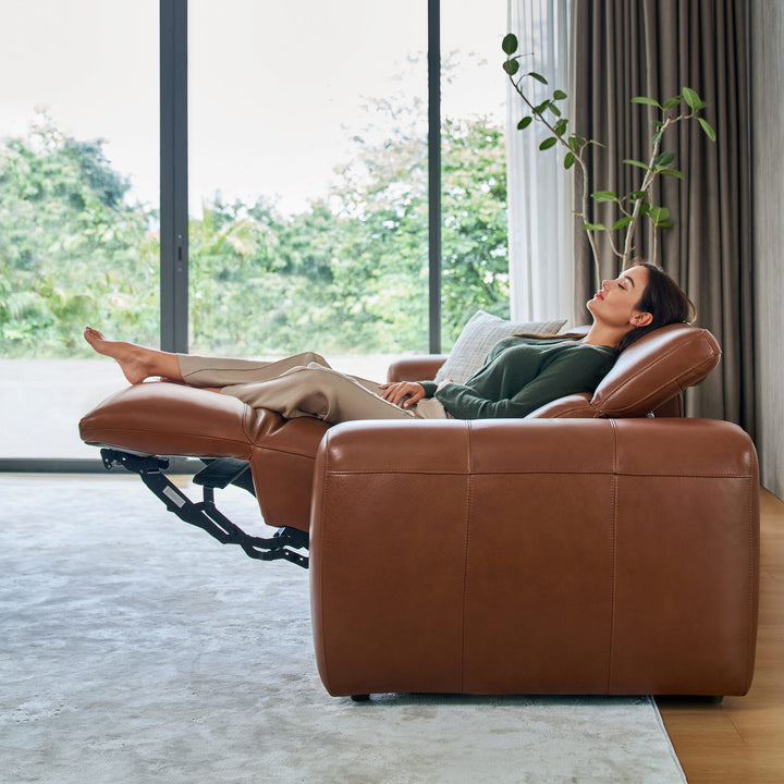 Side view of a fully reclined Cambridge seat in tan leather
