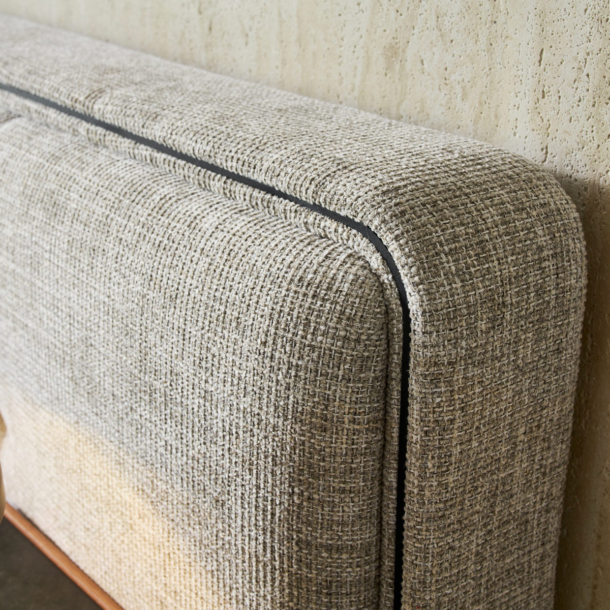 Close-up of the FB-SANTI-130 fabric and black trim on the Clara Bed headboard