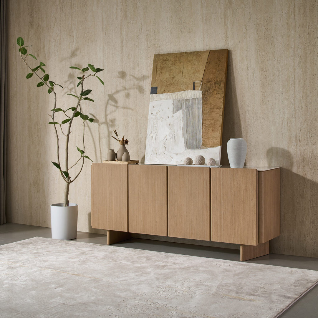 Iris Buffet in Boston Oak veneer with a Bianco ceramic stone top, angled view