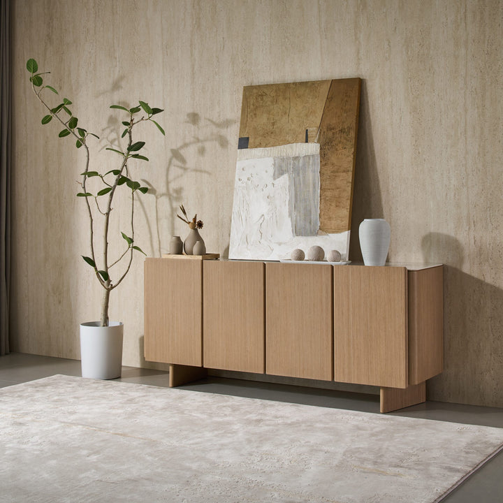 Iris Buffet in Boston Oak veneer with a Bianco ceramic stone top, angled view