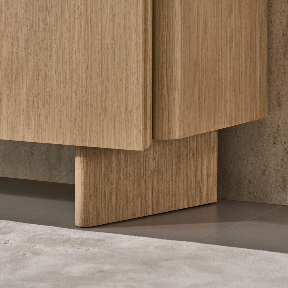 Iris Buffet base detail showing the rounded Boston Oak veneer plinth leg