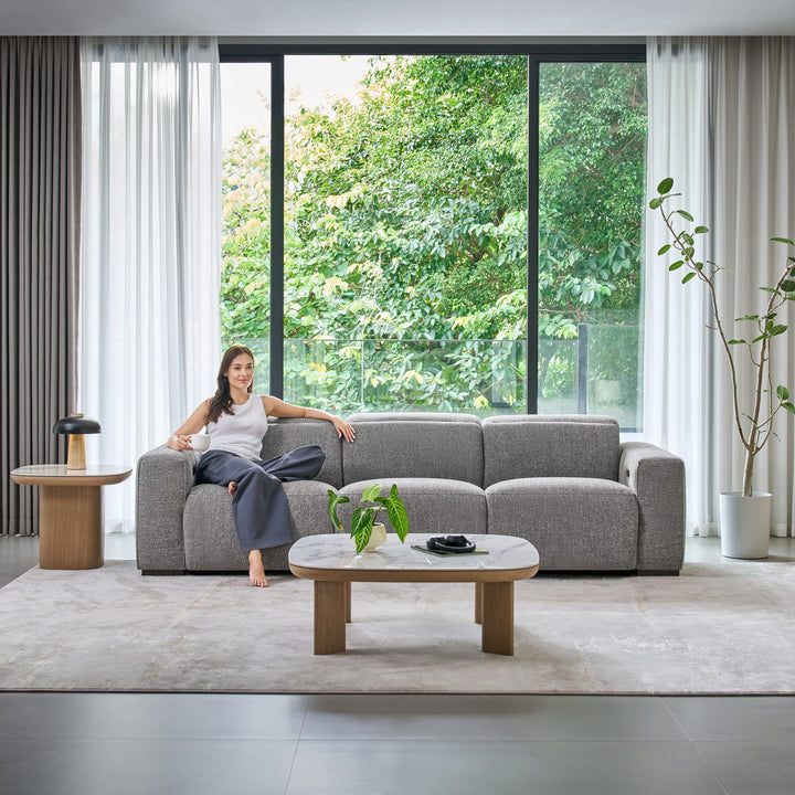 Jeddah 3 seat recliner sofa in grey fabric in a living room