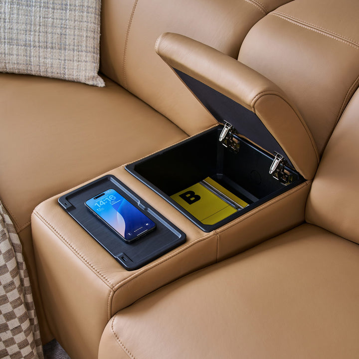 Jeddah media console with a wireless charging pad and an open storage compartment