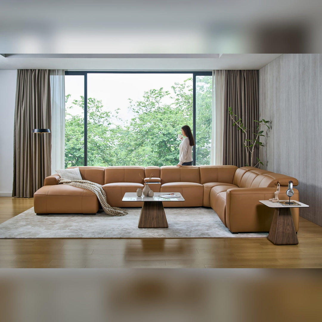 Jeddah U-shape corner sofa with chaise in tan leather in a large living room