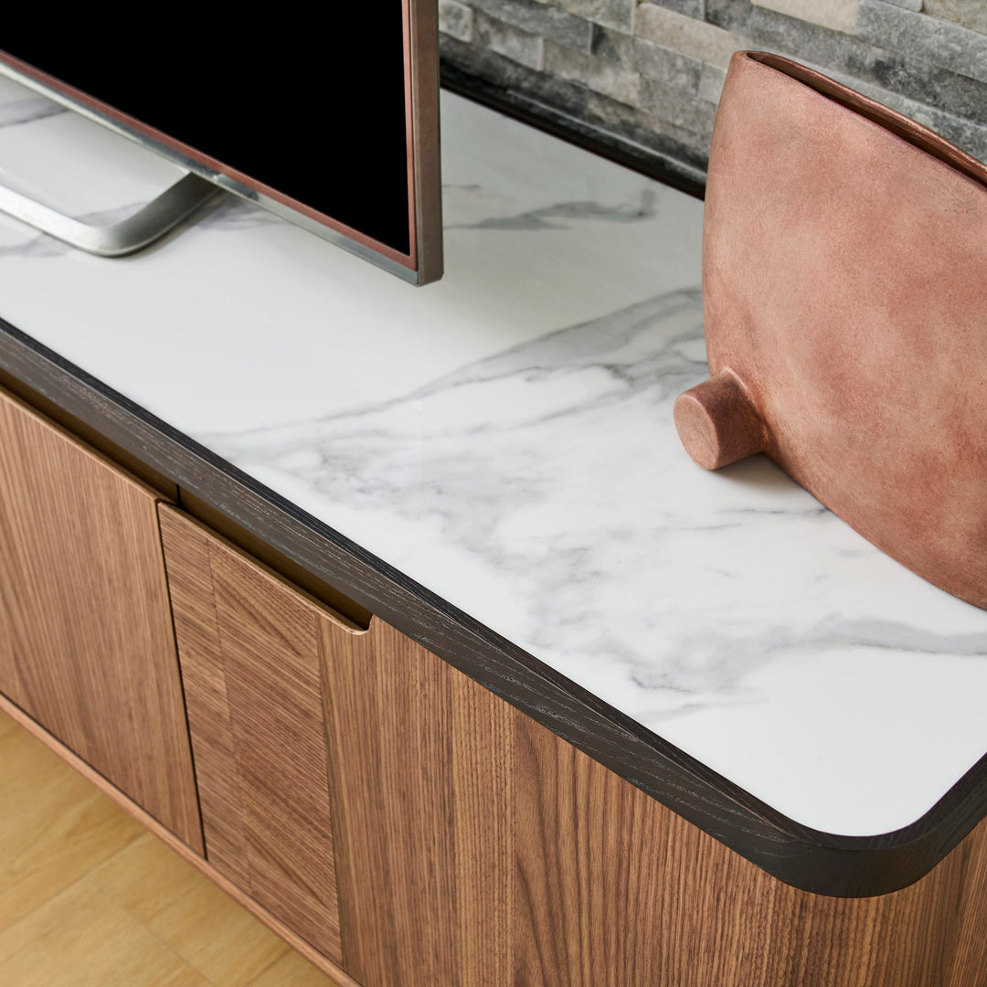 Close-up of the Rowan TV Unit Bianco ceramic stone top with Black Oak edge